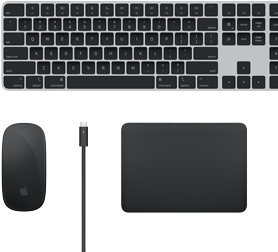Top view of Mac accessories: Magic Keyboard, Magic Mouse, Magic Trackpad and Thunderbolt cables.