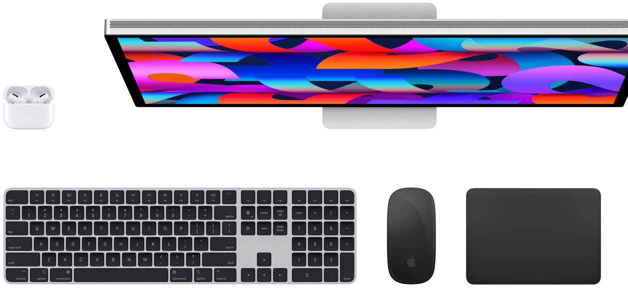 Top view of AirPods, Studio Display, Magic Keyboard, Magic Mouse and Magic Trackpad