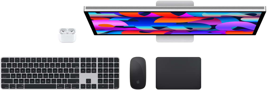 Top view of AirPods, Studio Display, Magic Keyboard, Magic Mouse and Magic Trackpad