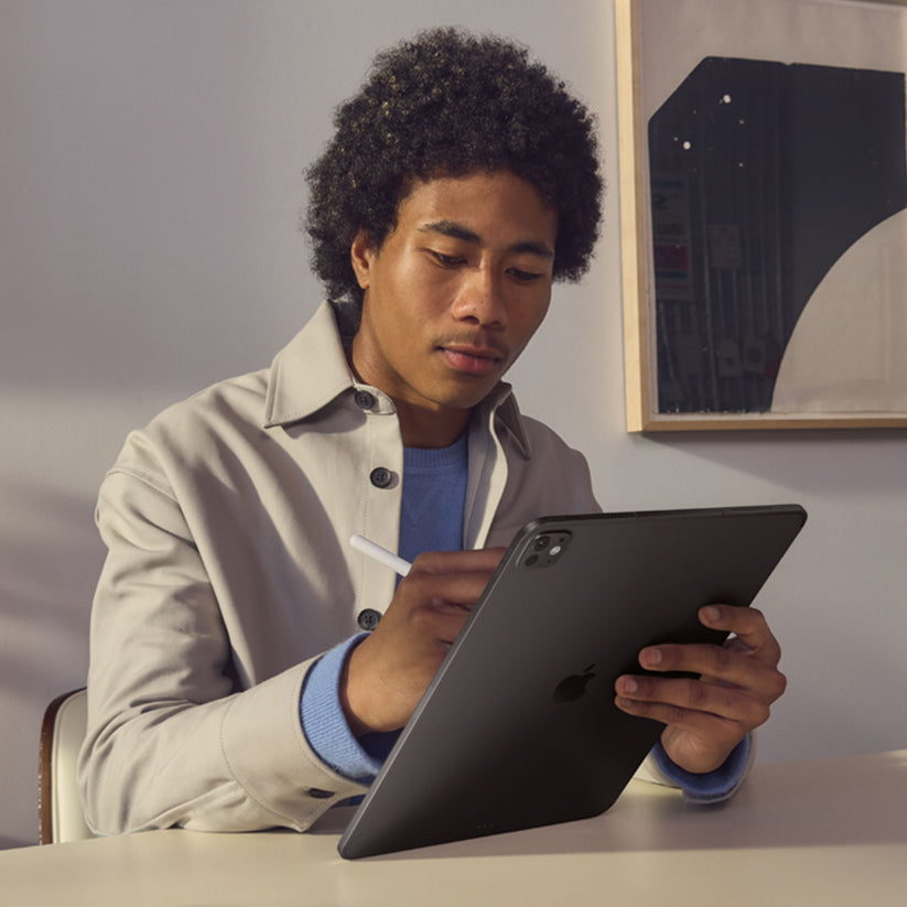 Person using 11-inch iPad Pro M5 in Silver with Apple Pencil Pro
